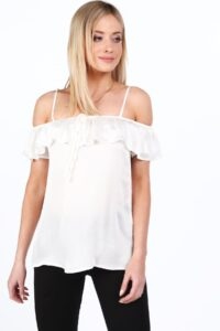 Cream blouse with ruffle on the