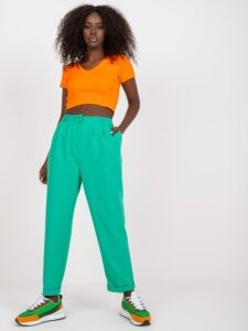 Green women's trousers made of fabric