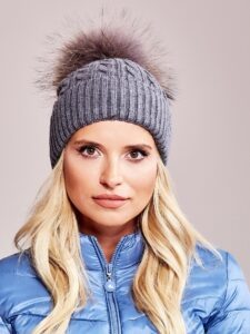 Knitted cap with fur pompom