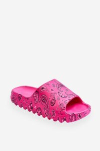 Fashionable women's slippers on a massive